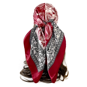 Detailed back view of a 90cm paisley silk scarf worn as a vintage style headwrap