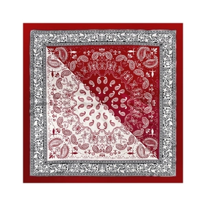 Macro detail of 90cm square silk scarf with paisley patterns and diagonal contrast design