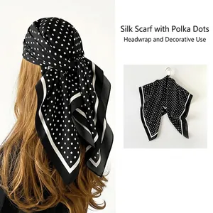 Elegant black and white polka dot silk-like square scarf with stylish striped border detail
