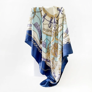 Detailed shot of satin square scarf with classic blue equestrian chain and buckle print