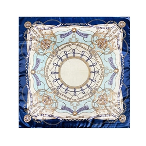 Detail of 90cm square silk scarf featuring classic blue chain and buckle patterns