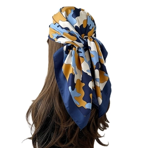 Fashionable large square silk scarf with abstract cloud print pattern in mustard and blue