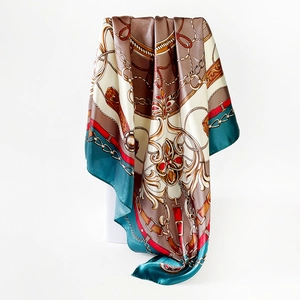 Detail of satin square scarf featuring vintage chain patterns and baroque belt designs