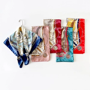 Detailed close-up showing satin finish and vintage chain prints on multi-color silk scarves