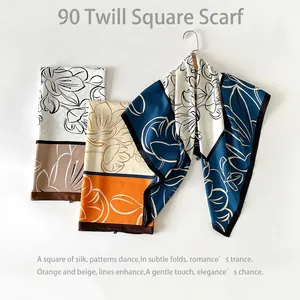 Elegant 90cm floral twill square silk scarf for women in blue, orange, and black patterns