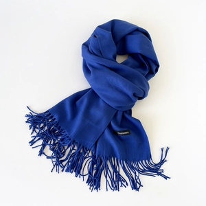 Close-up of royal blue cashmere blend scarf showing fine texture and fringe tassels