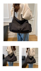 Detail view of large capacity black utility messenger bag with multiple front pockets