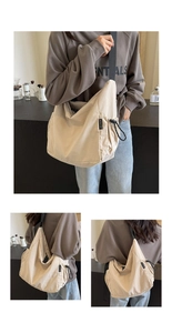 Close-up of cream white canvas messenger bag with drawstring pocket and sturdy fabric detail