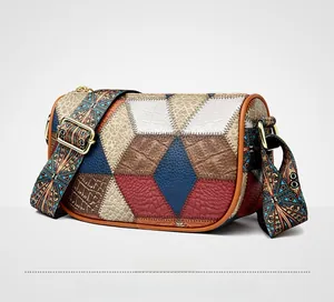 Detailed side view of multi-color patchwork shoulder bag with textured leather and wide strap