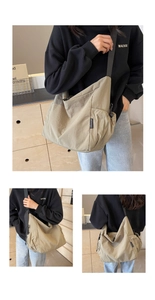 Detail of khaki nylon messenger bag with adjustable strap and side drawstring pockets
