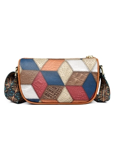 Women's patchwork crossbody bag with colorful broad strap and gold hardware