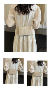 Detailed views of a cream woven straw crossbody bag with metal chain strap on a model