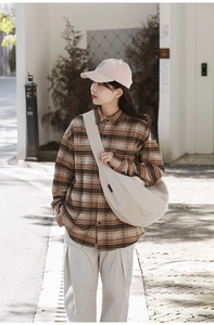 Japanese style large capacity nylon tote bag paired with brown flannel shirt and casual pants