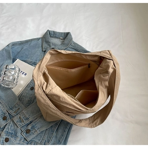 Top view of large capacity tote bag interior with zipper pocket and open slot