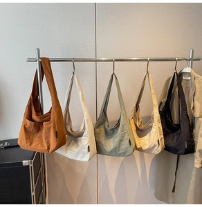 Selection of large capacity canvas tote bags in five earth tones for daily commuting