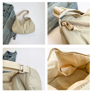 Details van de nylon schoudertas inclusief rits, gesp en het ruime binnenvakje