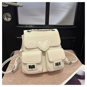 Detail view of cream white PU leather backpack with heart stitching and silver turn-locks