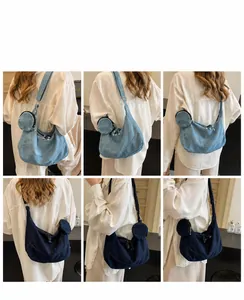 Multiple views of a crescent denim crossbody bag with a round coin purse attachment
