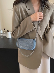 Blue denim rhinestone crossbody bag with silver chain strap for elegant evening wear