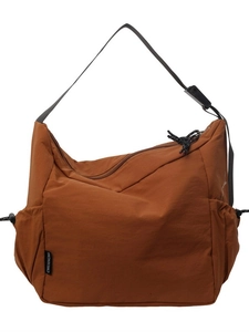 Caramel brown large capacity canvas crossbody bag with adjustable strap and side pockets