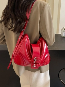 Red patent leather hobo bag with silver buckles and trendy pleated design for women