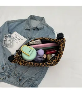 Detailed interior view of leopard print canvas crossbody bag showing large capacity space