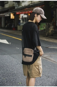 Street style khaki nylon crossbody bag with dual zipper compartments and D-ring detail