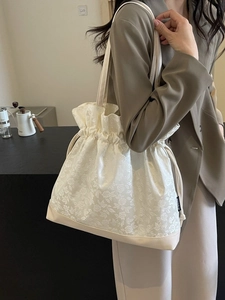 Chic cream drawstring tote bag with floral jacquard texture and ruffled edges for women