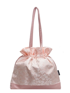 Pink floral jacquard drawstring tote bag with elegant satin texture and faux leather base
