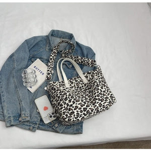 Detailed leopard print canvas tote bag with a matching wide adjustable shoulder strap