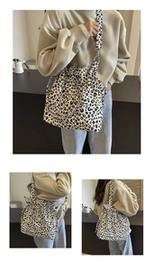 Detail view of the drawstring closure and adjustable strap on leopard print canvas bag