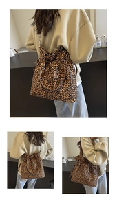 Detail view of leopard print canvas tote bag with drawstring closure and large capacity