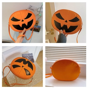 Detail showing the orange pumpkin bag with a spooky face and adjustable shoulder strap