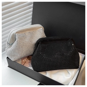 Close-up of sparkling black and silver rhinestone shell evening bags in a luxury gift box