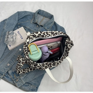 Spacious leopard print canvas tote bag showing interior capacity with daily essentials