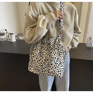 Detail of leopard print canvas bag with drawstring closure and comfortable wide strap