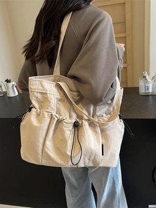 Large capacity beige pleated tote bag with utility drawstring pockets for college students