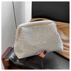 Close-up of luxury sparkling rhinestone dinner clutch bag with silver crystal finish
