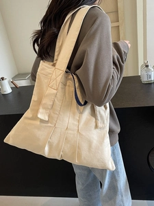 Minimalist large capacity canvas tote bag with contrast blue handle for casual daily wear