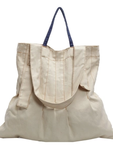 Vintage large canvas tote bag in off-white with blue handles and stylish stitching