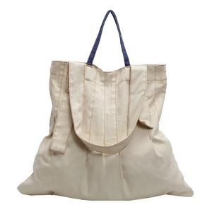 Minimalist canvas tote bag with contrast denim handles and orange stitching detail