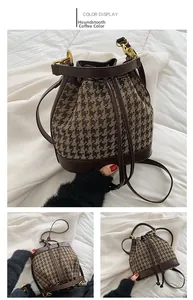 Detail view of coffee-colored houndstooth bucket bag with synthetic leather base