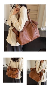 Detail view of large brown vintage tote bag with star rivets and adjustable straps