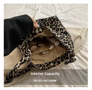 Leopard print canvas tote bag interior view with beige lining and zip pocket
