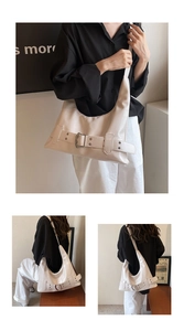 Detailed views of a cream faux leather hobo bag featuring retro belt buckle accents