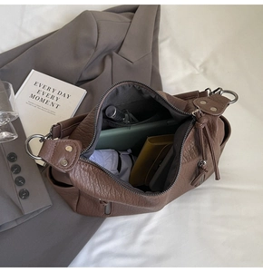 Spacious interior of brown lychee grain tote bag with phone, wallet and umbrella