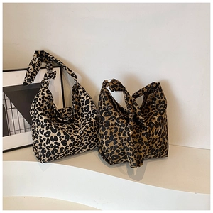 Close-up of leopard print canvas hobo bags with stylish knotted shoulder strap detail