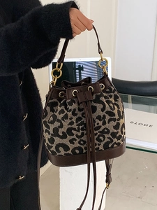 Leopard print bucket bag in jacquard canvas with brown leather trim and golden ring hardware