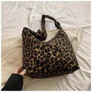 Detail of trendy leopard print canvas tote bag showing soft texture and spacious design