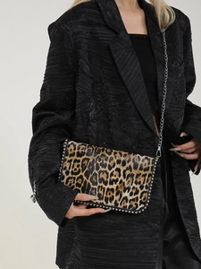 Chic leopard print crossbody bag with silver stud accents and delicate chain strap